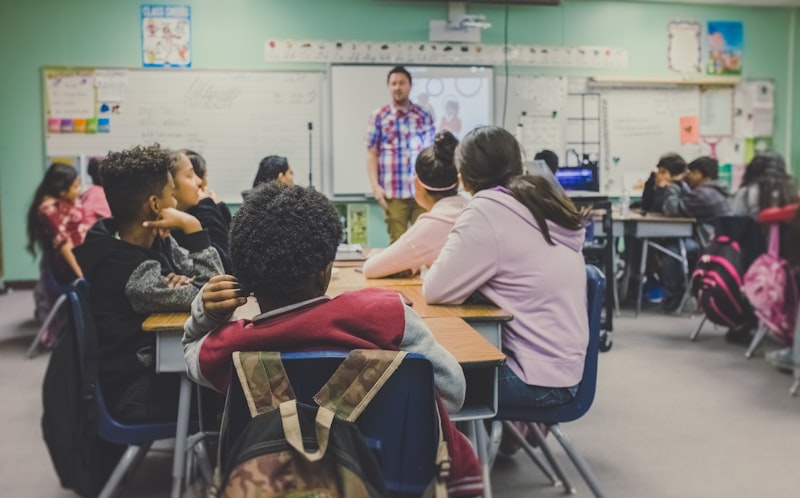 Secondary grade students studying in groups for higher academics